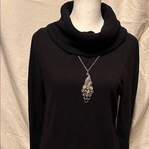 Rafaella. This is a women's clothing brand known for offering comfortable styles